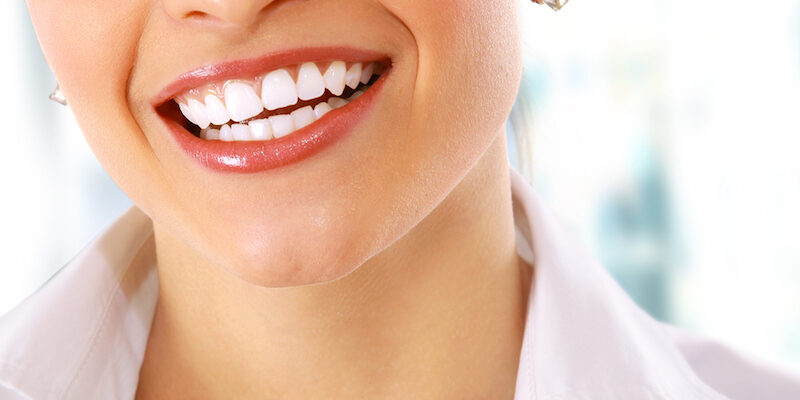 Close up of a woman with straight white teeth