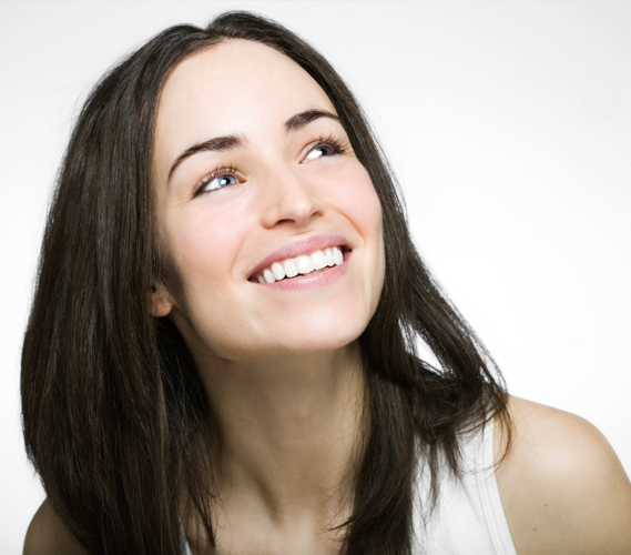 Smiling Invisalign patient in Allen Park shows off new smile