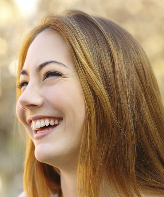 Dental veneers patient smiling with new teeth in Taylor, MI